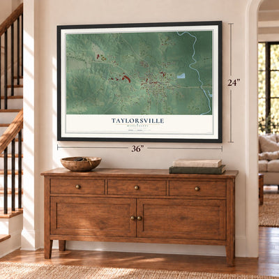 Taylorsville, Mississippi map, 24 x 36 inch print in a black frame above a dresser by a staircase