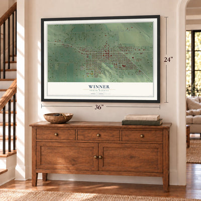 Winner, South Dakota map, 24 x 36 inch print in a black frame above a dresser by a staircase