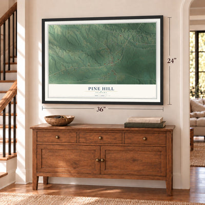 Pine Hill, Alabama map, 24 x 36 inch print in a black frame above a dresser by a staircase