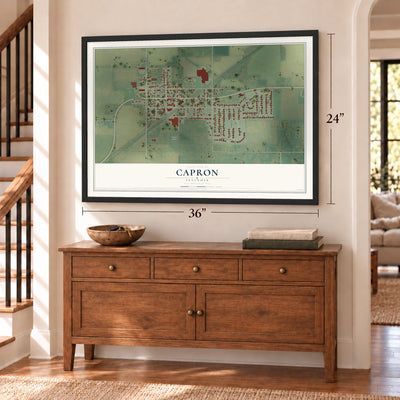 Capron, Illinois map, 24 x 36 inch print in a black frame above a dresser by a staircase