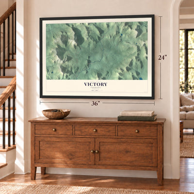 Victory, Vermont map, 24 x 36 inch print in a black frame above a dresser by a staircase