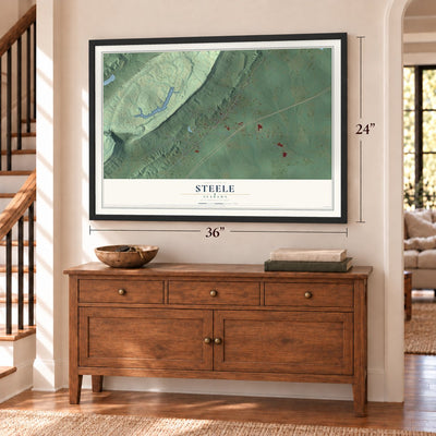 Steele, Alabama map, 24 x 36 inch print in a black frame above a dresser by a staircase
