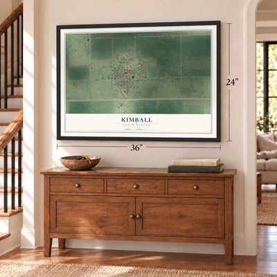 Kimball, South Dakota map, 24 x 36 inch print in a black frame above a dresser by a staircase