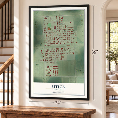 Utica, Nebraska map, 24 x 36 inch print in a black frame by a staircase