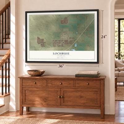 Lochbuie, Colorado map, 24 x 36 inch print in a black frame above a dresser by a staircase