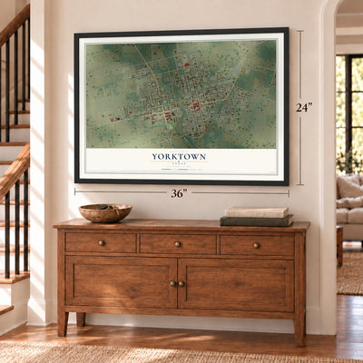 Yorktown, Texas map, 24 x 36 inch print in a black frame above a dresser by a staircase