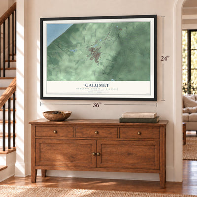 Calumet, Houghton County, Michigan map, 24 x 36 inch print in a black frame above a dresser by a staircase