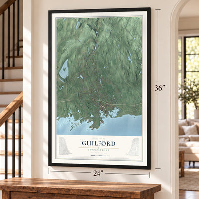 Guilford, Connecticut map, 24 x 36 inch print in a black frame by a staircase