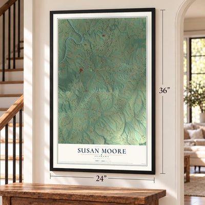 Susan Moore, Alabama map, 24 x 36 inch print in a black frame by a staircase