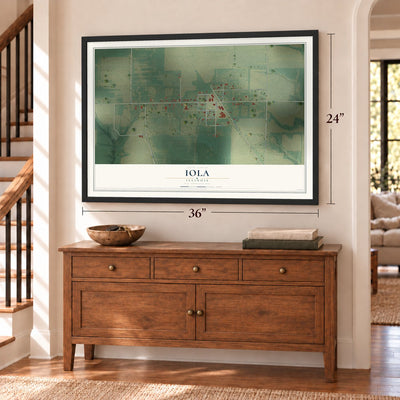 Iola, Illinois map, 24 x 36 inch print in a black frame above a dresser by a staircase