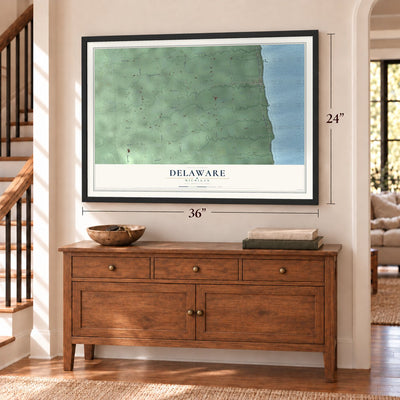 Delaware, Michigan map, 24 x 36 inch print in a black frame above a dresser by a staircase