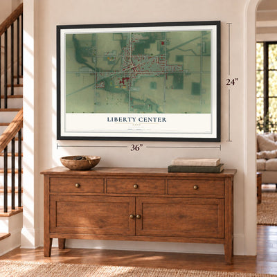 Liberty Center, Ohio map, 24 x 36 inch print in a black frame above a dresser by a staircase