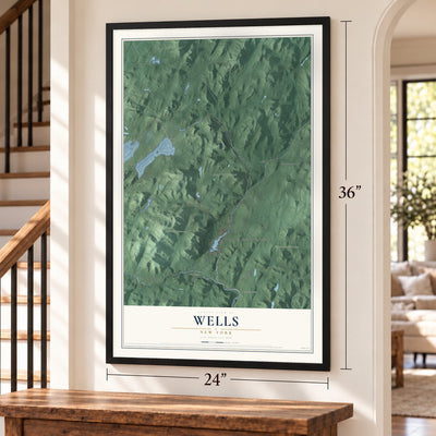 Wells, New York map, 24 x 36 inch print in a black frame by a staircase
