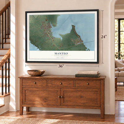 Manteo, North Carolina map, 24 x 36 inch print in a black frame above a dresser by a staircase