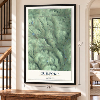 Guilford, New York map, 24 x 36 inch print in a black frame by a staircase