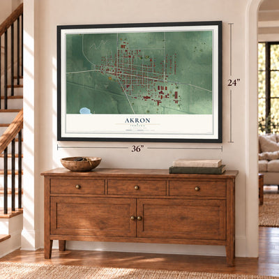 Akron, Indiana map, 24 x 36 inch print in a black frame above a dresser by a staircase