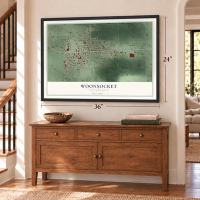 Woonsocket, South Dakota map, 24 x 36 inch print in a black frame above a dresser by a staircase
