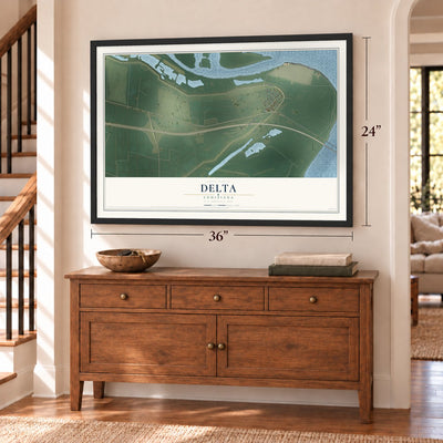 Delta, Louisiana map, 24 x 36 inch print in a black frame above a dresser by a staircase