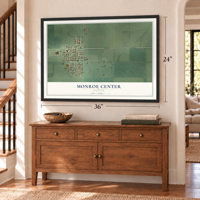Monroe Center, Illinois map, 24 x 36 inch print in a black frame above a dresser by a staircase