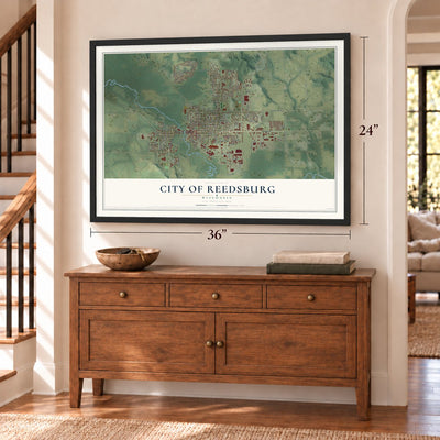Reedsburg, Wisconsin map, 24 x 36 inch print in a black frame above a dresser by a staircase