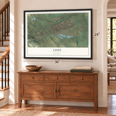 Cody, Wyoming map, 24 x 36 inch print in a black frame above a dresser by a staircase
