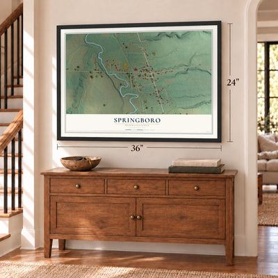 Springboro, Pennsylvania map, 24 x 36 inch print in a black frame above a dresser by a staircase