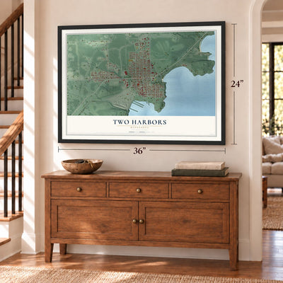 Two Harbors, Minnesota map, 24 x 36 inch print in a black frame above a dresser by a staircase