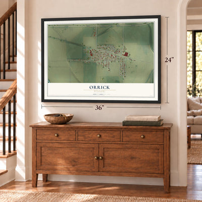 Orrick, Missouri map, 24 x 36 inch print in a black frame above a dresser by a staircase