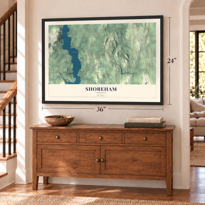 Shoreham, Vermont map, 24 x 36 inch print in a black frame above a dresser by a staircase