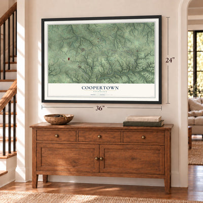 Coopertown, Tennessee map, 24 x 36 inch print in a black frame above a dresser by a staircase