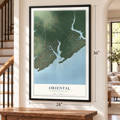 Oriental, North Carolina map, 24 x 36 inch print in a black frame by a staircase