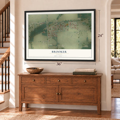 Brooker, Florida map, 24 x 36 inch print in a black frame above a dresser by a staircase