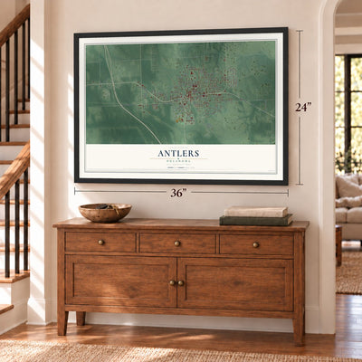 Antlers, Oklahoma map, 24 x 36 inch print in a black frame above a dresser by a staircase