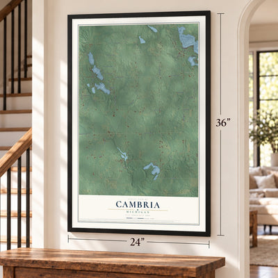 Cambria, Michigan map, 24 x 36 inch print in a black frame by a staircase