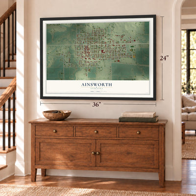 Ainsworth, Nebraska map, 24 x 36 inch print in a black frame above a dresser by a staircase