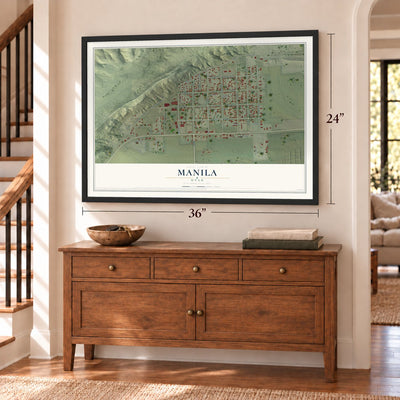 Manila, Utah map, 24 x 36 inch print in a black frame above a dresser by a staircase
