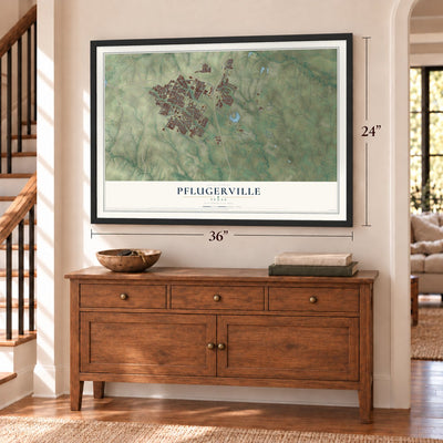 Pflugerville, Texas map, 24 x 36 inch print in a black frame above a dresser by a staircase