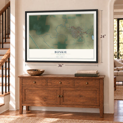 Bunkie, Louisiana map, 24 x 36 inch print in a black frame above a dresser by a staircase