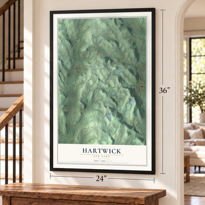 Hartwick, New York map, 24 x 36 inch print in a black frame by a staircase