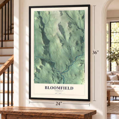 Bloomfield, Vermont map, 24 x 36 inch print in a black frame by a staircase