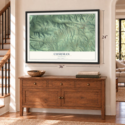 Cushman, Arkansas map, 24 x 36 inch print in a black frame above a dresser by a staircase