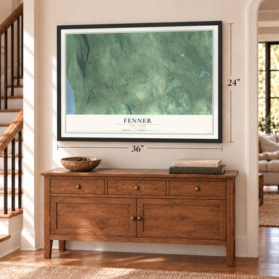 Fenner, New York map, 24 x 36 inch print in a black frame above a dresser by a staircase