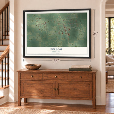 Folsom, Louisiana map, 24 x 36 inch print in a black frame above a dresser by a staircase