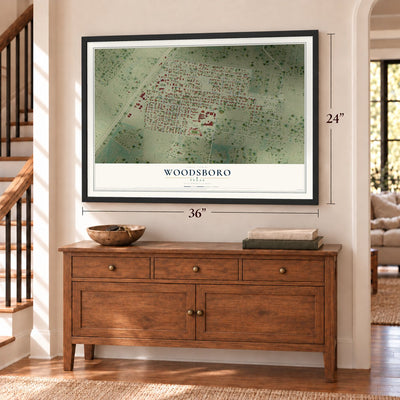 Woodsboro, Texas map, 24 x 36 inch print in a black frame above a dresser by a staircase