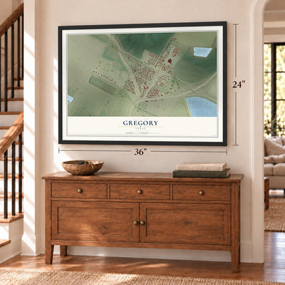 Gregory, Texas map, 24 x 36 inch print in a black frame above a dresser by a staircase