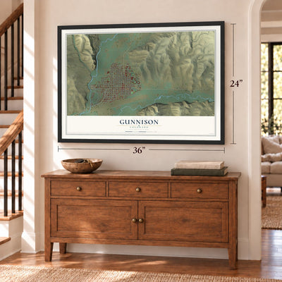 Gunnison, Colorado map, 24 x 36 inch print in a black frame above a dresser by a staircase
