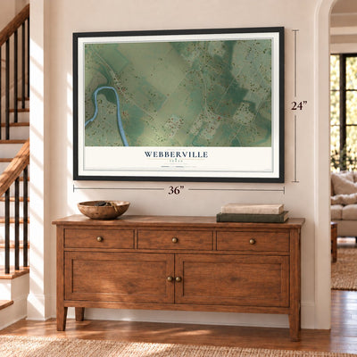 Webberville, Texas map, 24 x 36 inch print in a black frame above a dresser by a staircase