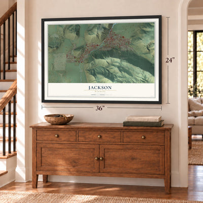 Jackson, Wyoming map, 24 x 36 inch print in a black frame above a dresser by a staircase