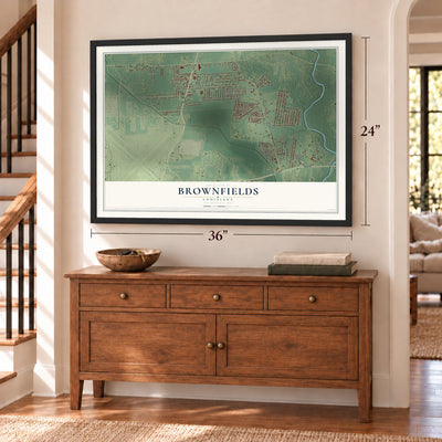 Brownfields, Louisiana map, 24 x 36 inch print in a black frame above a dresser by a staircase