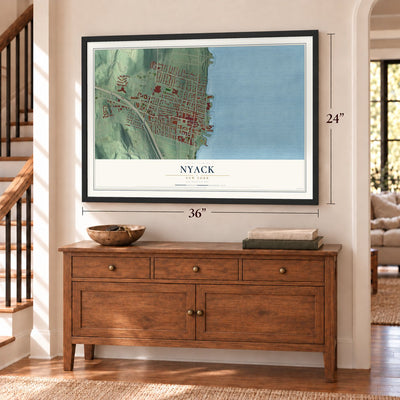 Nyack, New York map, 24 x 36 inch print in a black frame above a dresser by a staircase